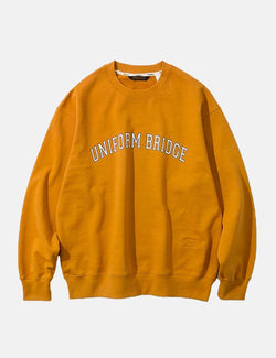 ユニフォームブリッジアーチロゴスウェットシャツ-オレンジ